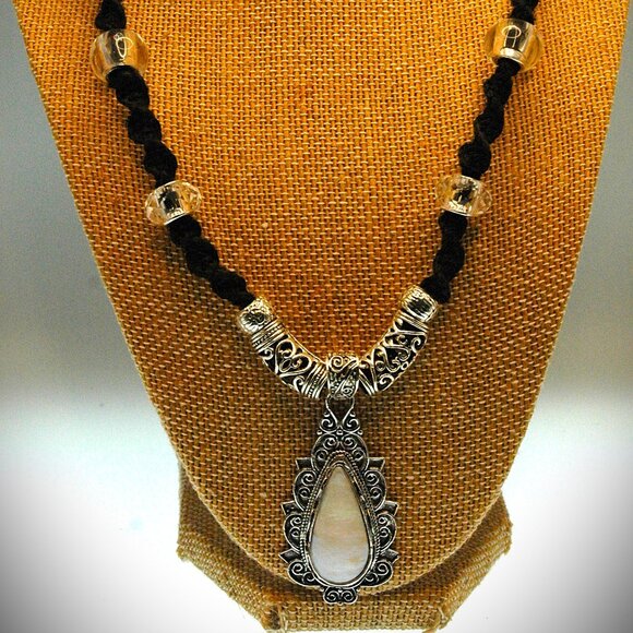 Elegant Opalescence Teardrop Cabochon on a 20" Handmade Black Hemp Necklace - Picture 2 of 7
